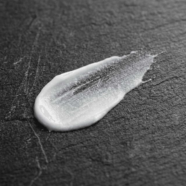 Cream texture close-up on stone